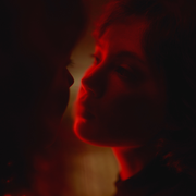 How to Stop Overthinking Your Relationship, According to Experts a pensive woman looking into her partner's eyes